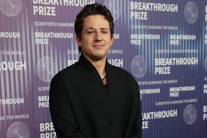 Charlie Puth poses on the red carpet of the Breakthrough Prize Awards and Ceremony