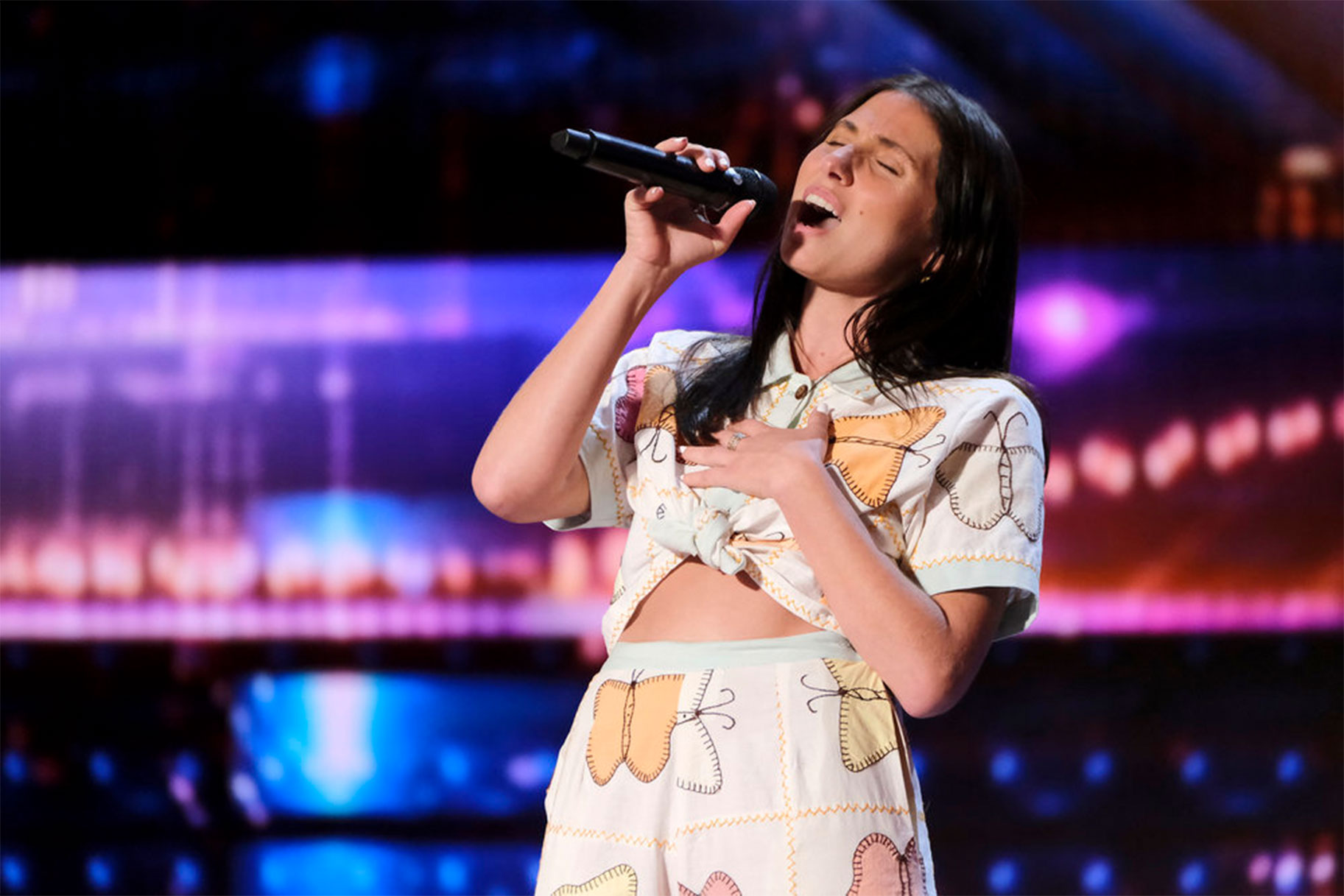 Lily Meola performing on the AGT stage