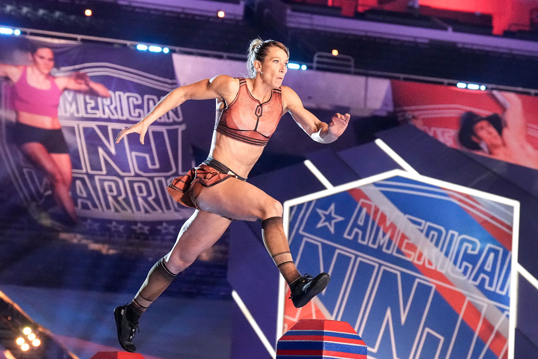 American Ninja Warrior Jessie Graff running through an obstacle
