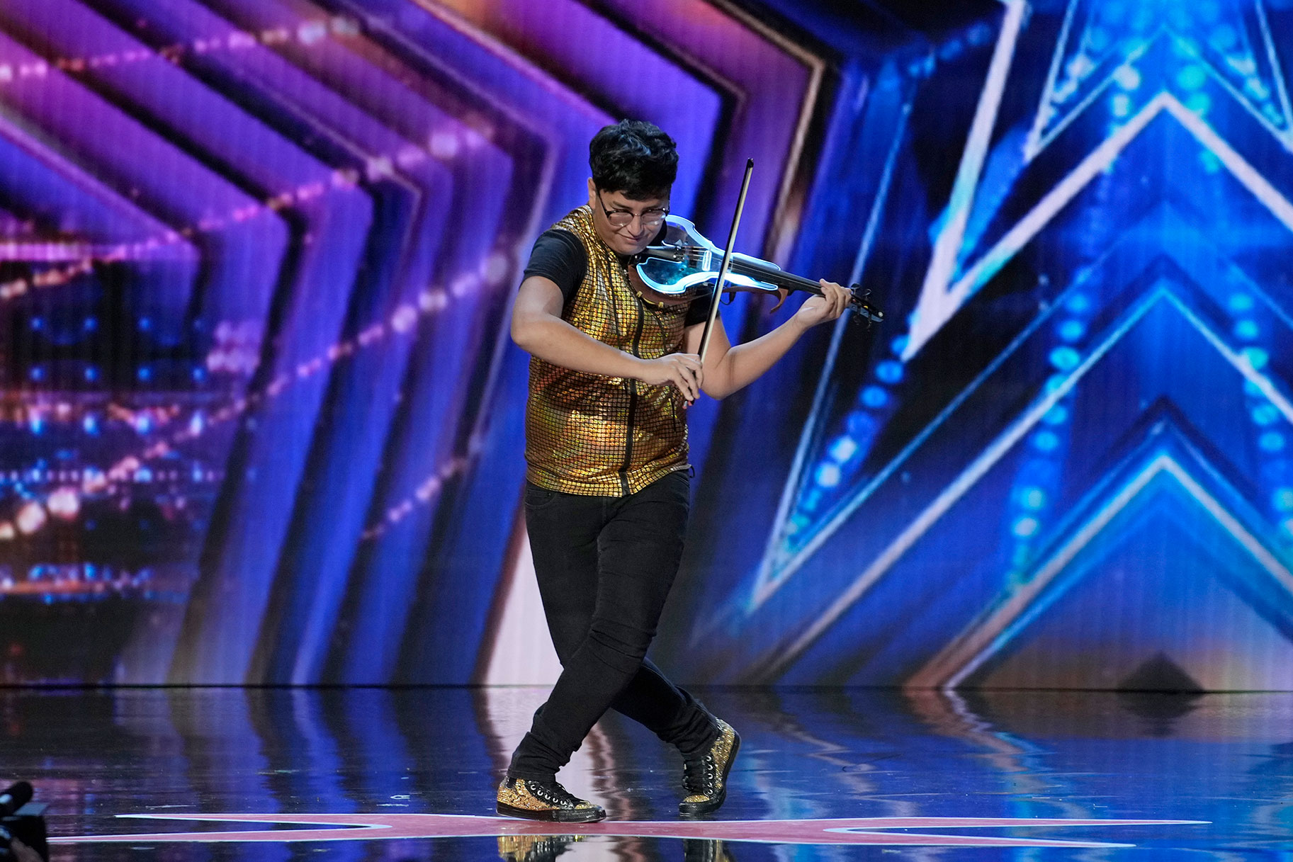 Alex Rivers performing on the AGT stage