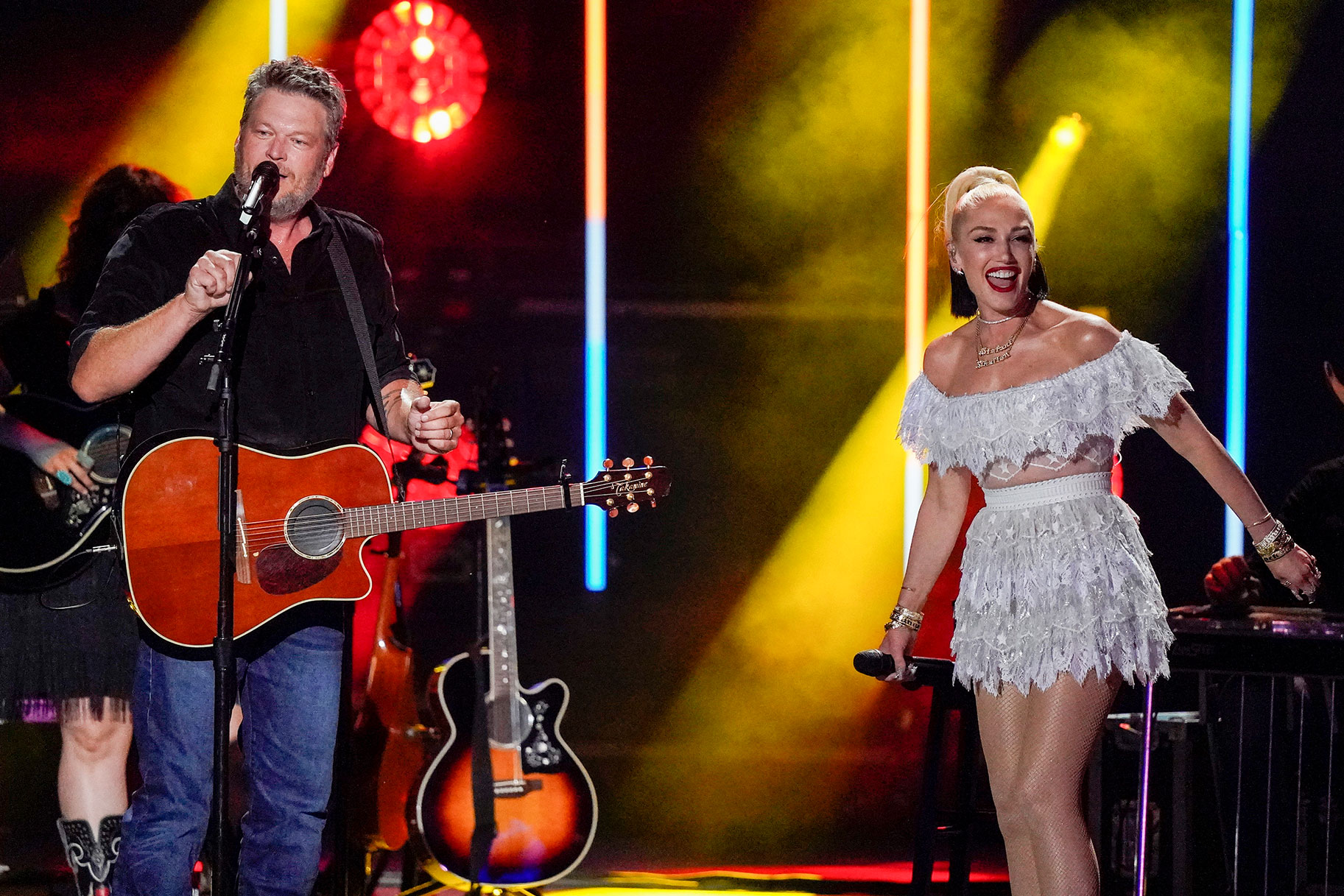 Gwen Stefani and Blake Shelton performing onstage