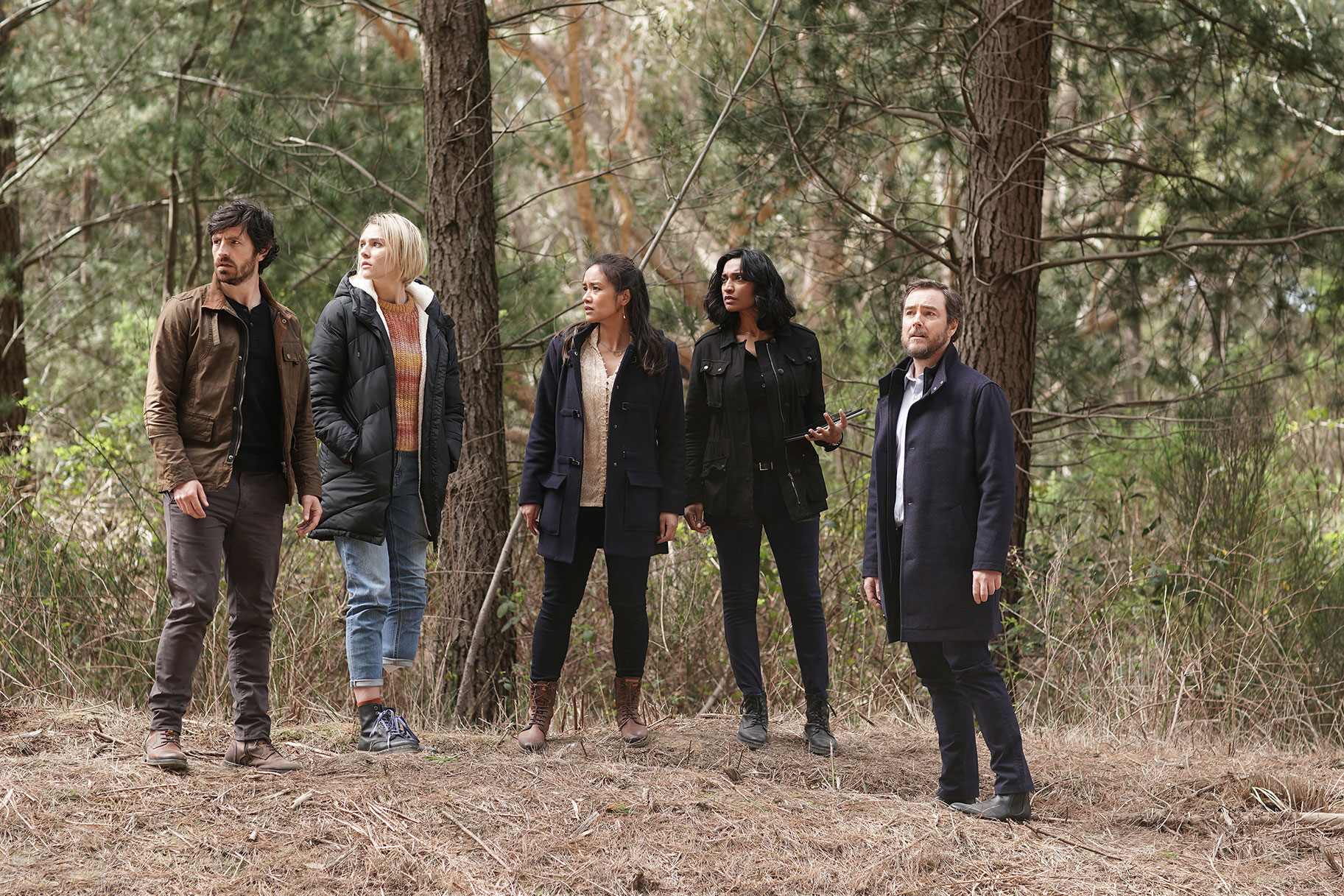 La Brea cast standing on the forest