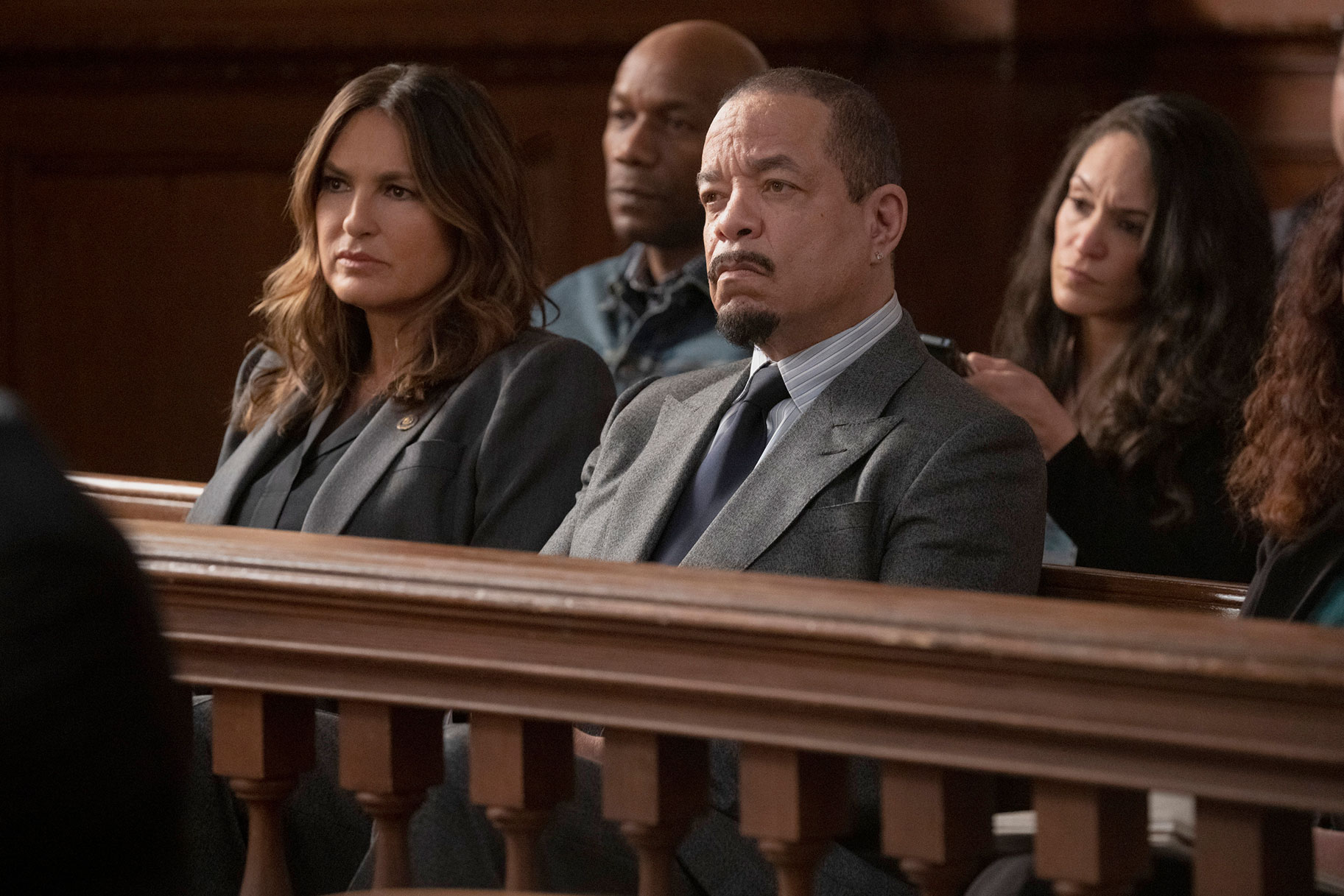 Captain Olivia Benson anqd Sergeant Odafin "Fin" Tutuola sitting together in a courtroom