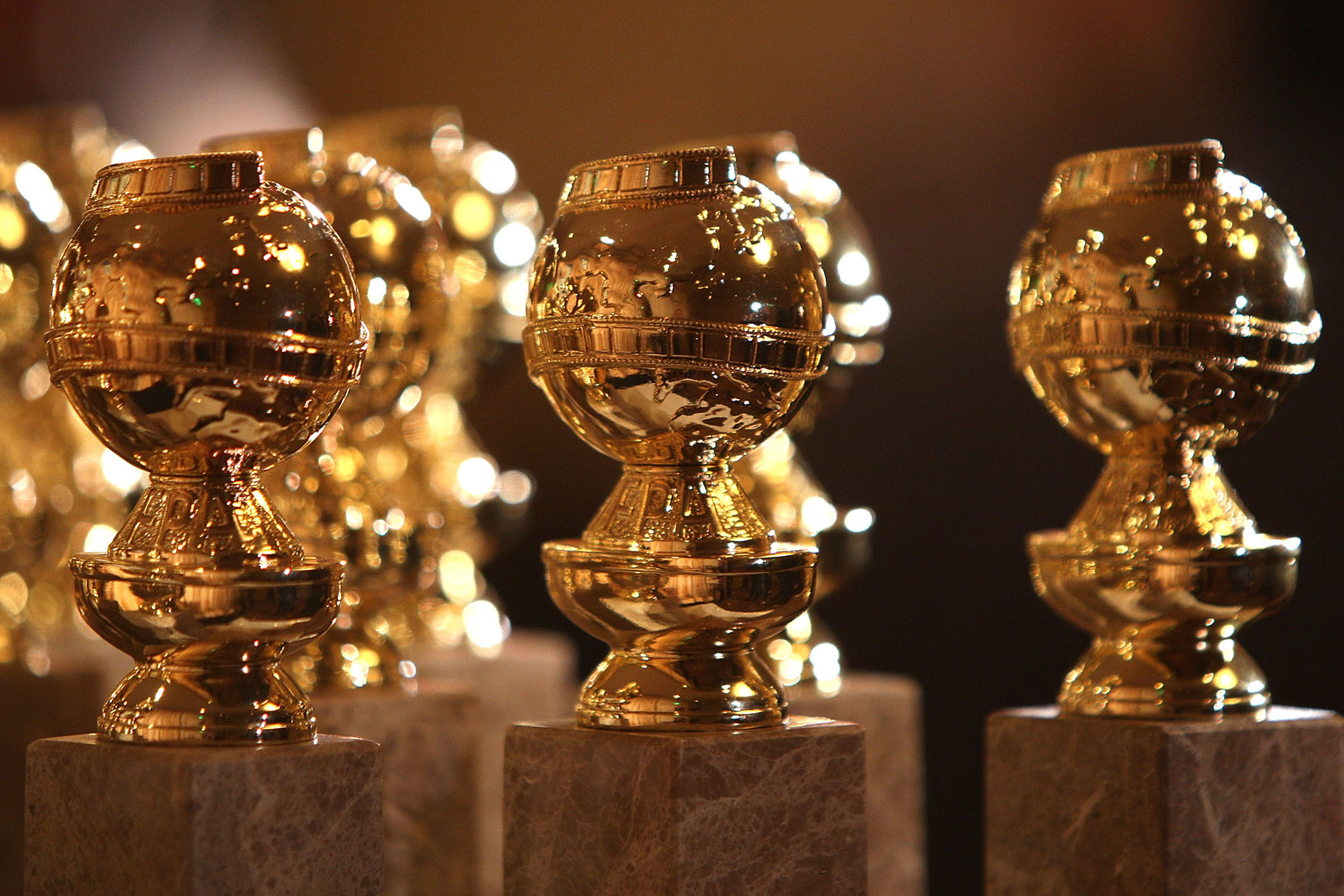 A row of Golden Globe awards