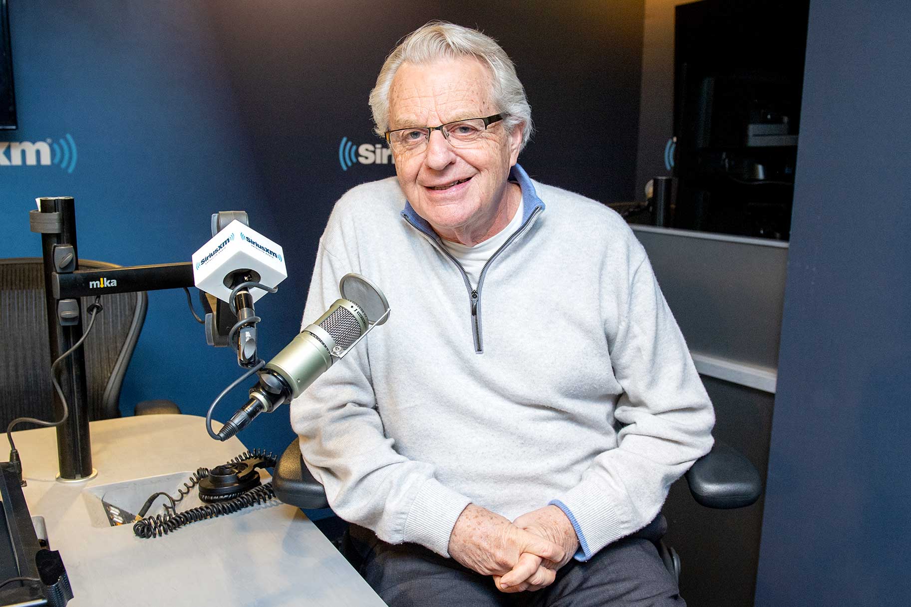 Jerry Springer smiling at SiriusXM Studios.