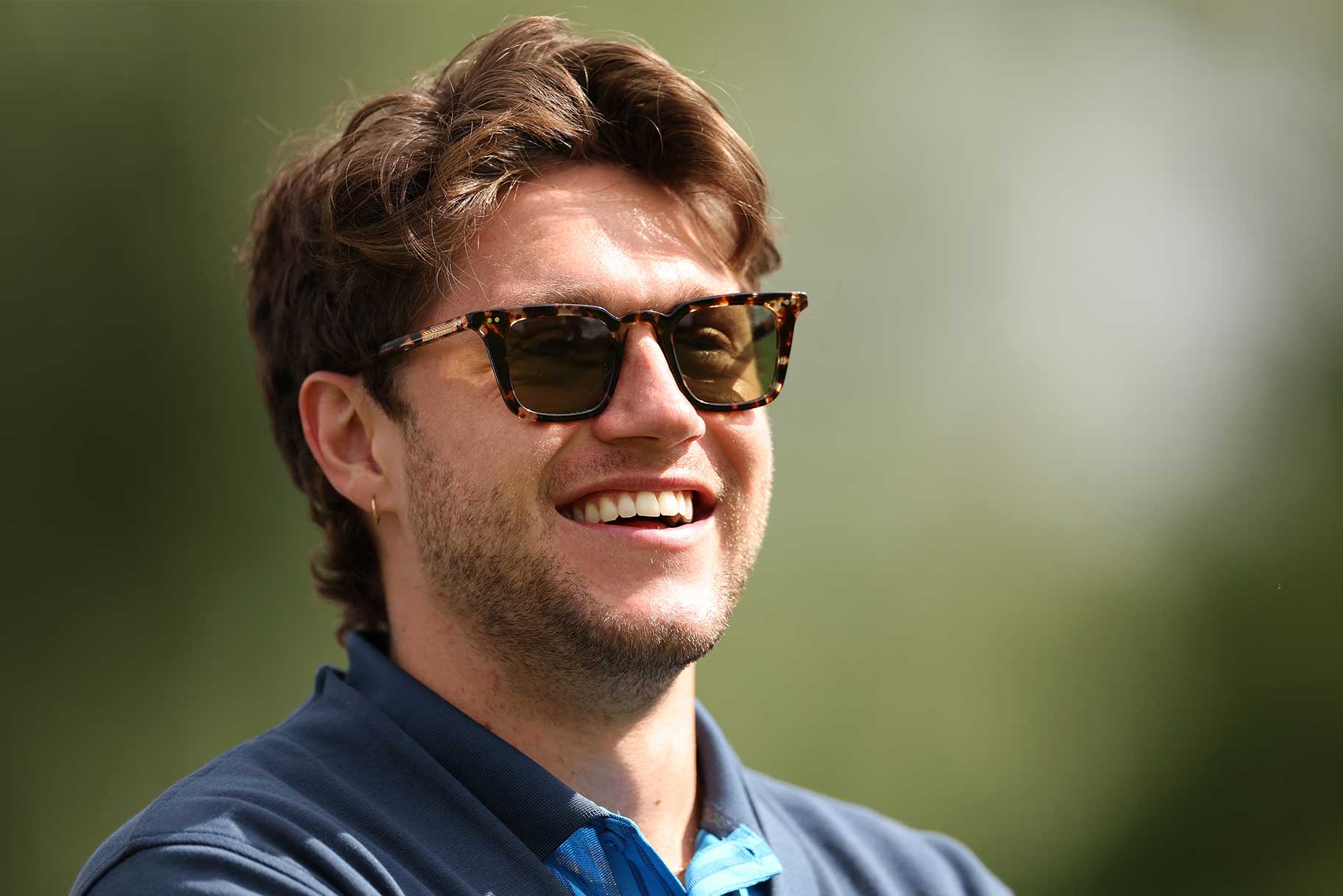 Niall Horan shares a joke at the 11th tee during Day One of the JP McManus Pro-Am at Adare Manor
