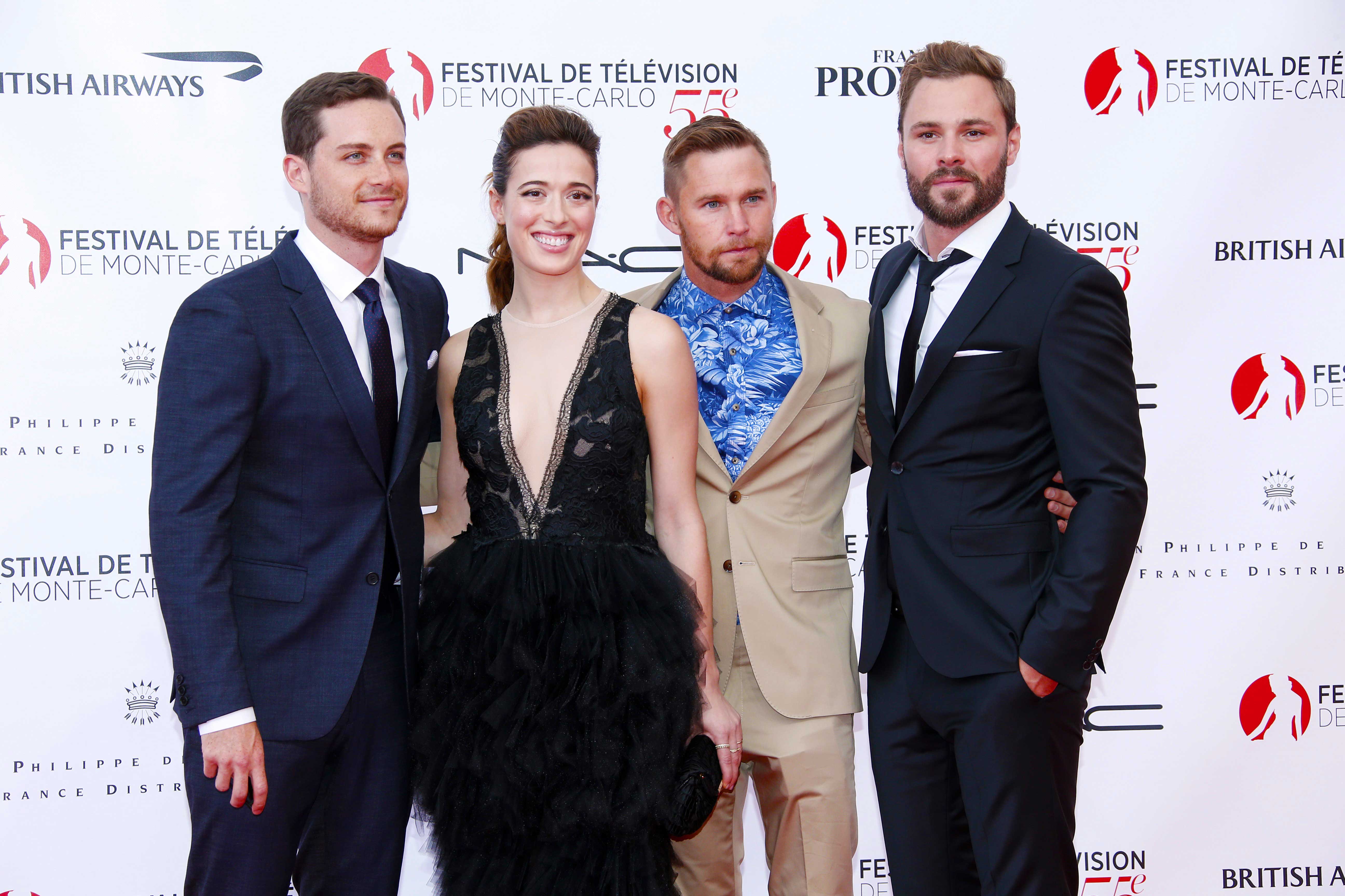 Jesse Lee Soffer, Marina Squerciati, Brian Geraghty and Patrick Flueger posing at an event.