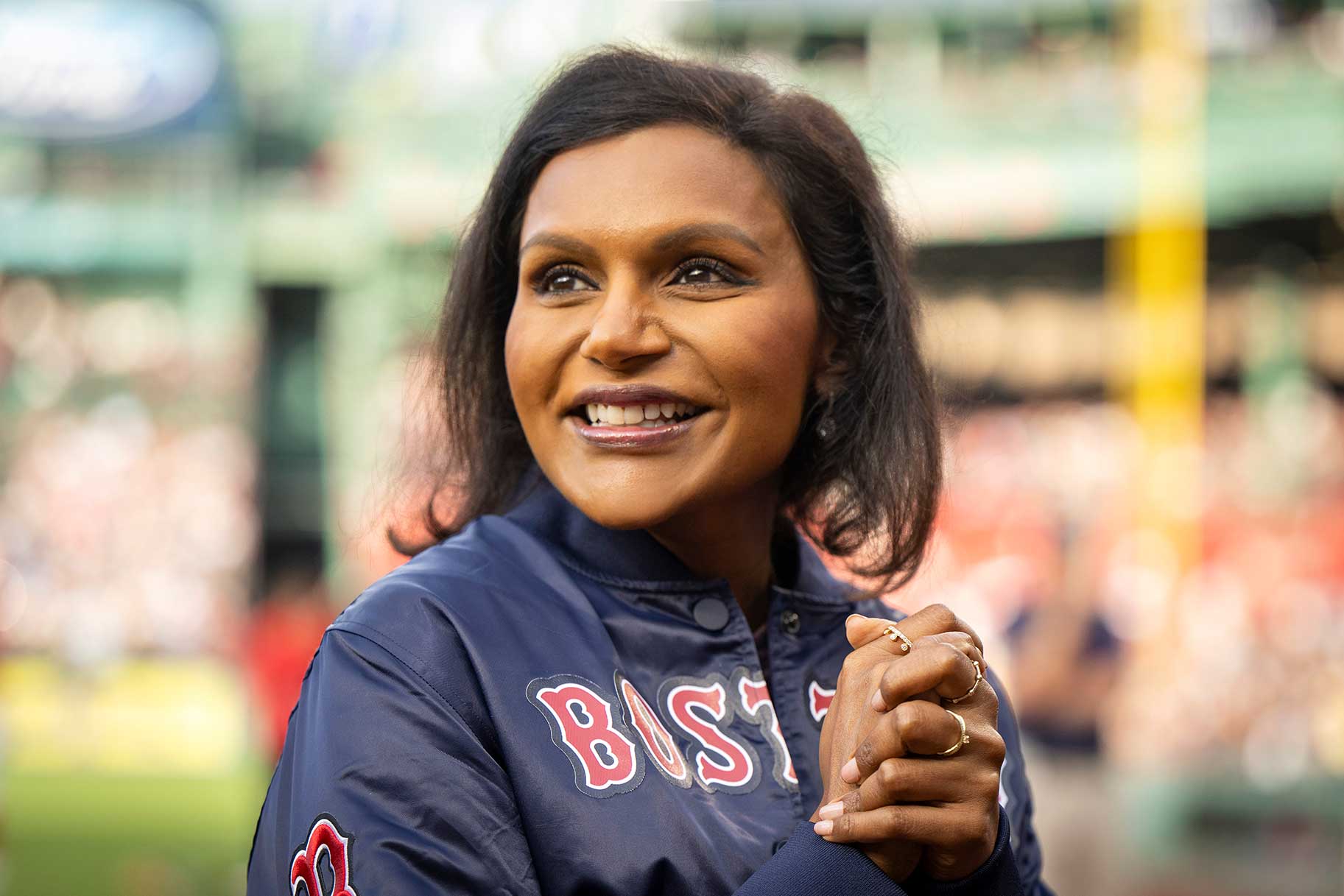 Mindy Kaling appears at a baseball game.