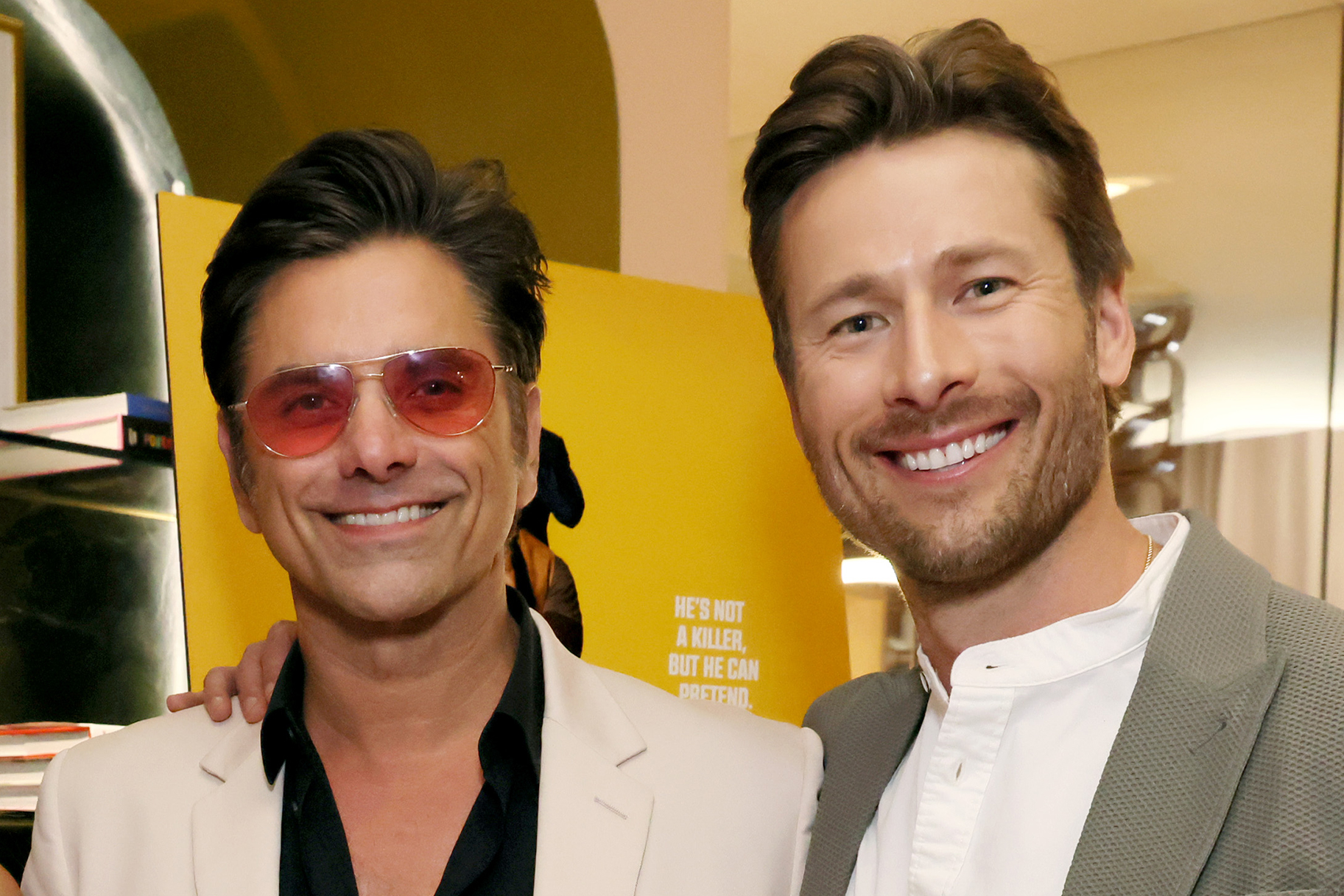 See Glen Powell Get His Makeup Done by John Stamos (VIDEO) NBC Insider
