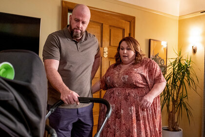 Kate (Chrissy Metz) and Toby (Chris Sullivan) looking over baby Jack on This Is Us