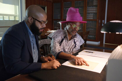 Dr. Christopher Bonner, Historian of University of Maryland and Billy Porter sat at a table with each other