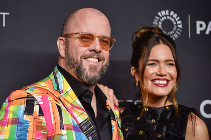 Chirs Sullivan and Mandy Moore smiling and posing together