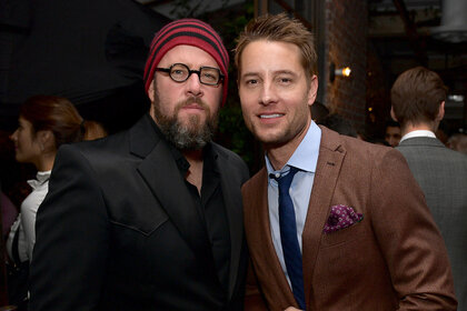 Justin Hartley and Chris Sullivan posign for a photo together