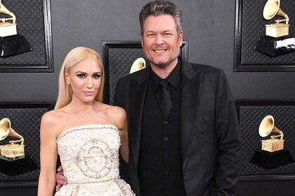 Blake Shelton and Gwen Stefani posing at the 62nd Annual Grammy Awards.