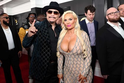 Ice-T posing next to his wife, Coco at the 65th Annual Grammy Awards