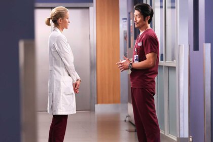 Hannah Asher (Jessy Schram) and Ethan Choi (Brian Tee) standing face to face on the set of Chicago Med.