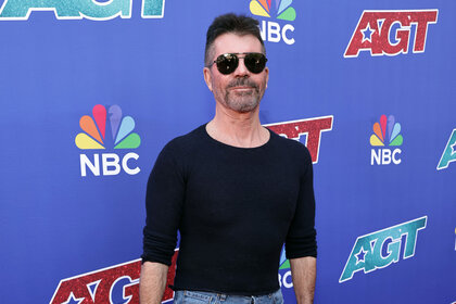 Simon Cowell attends an America's Got Talent red carpet.