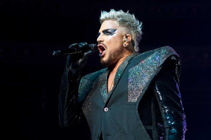Adam Lambert performing on stage.