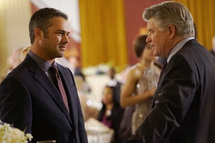 Actors Taylor Kinney and Treat Williams together in a scene from Chicago Fire.