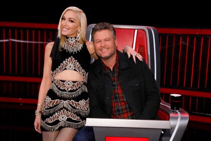 Gwen Stefani and Blake Shelton posing together during The Voice.