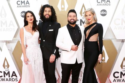 Dan Smyers and Shay Mooney with their wives at the 53rd annual CMA Awards.
