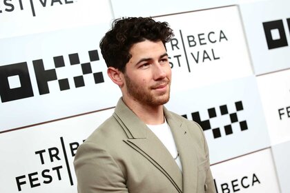 Nick Jonas walking the red carpet at the Tribeca Film Festival.