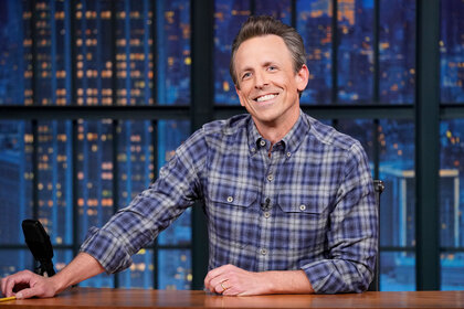 Seth Meyers sits behind his desk while hosting 'Late Night with Seth Meyers'