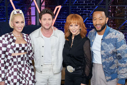 Gwen Stefani, Niall Horan, Reba McEntire, and John Legend pose for a picture before the start of the Season 24 premiere of The Voice