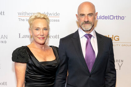 Chris and Sherman Meloni pose together on the red carpets at an event