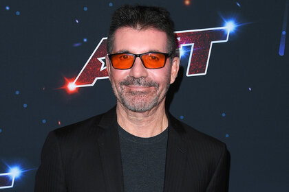 Simon Cowell on the red carpet wearing glasses at the "America's Got Talent" Season 18 Finale