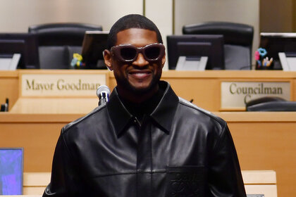 Usher smiles while accepting the key to Las Vegas