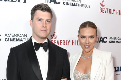 Colin Jost and Scarlett Johansson pose together on the red carpet at he 35th Annual American Cinematheque Awards
