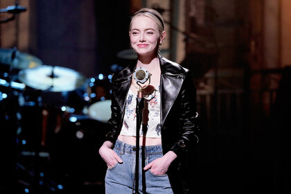 Emma Stone stands on stage during Saturday Night Live Promos
