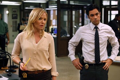 Det. Amanda Rollins (Kelli Giddish) and Det. Nick Amaro (Danny Pino) stand in a police office in Law & Order: Special Victims Unit 1301
