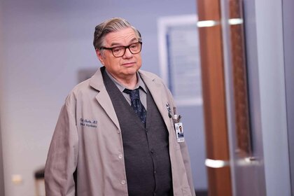 Dr. Daniel Charles wears a doctor's coat in Chicago Med Episode 902.