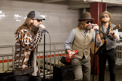 Adam Levine, Jimmy Fallon, and Maroon 5 performing in disguise in the New York City Subway