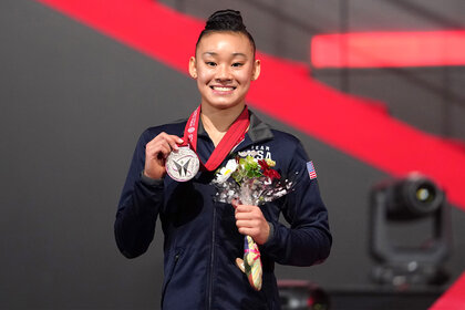 Leanne Wong poses with her medal during a victory ceremony of the Women's All-Around Final