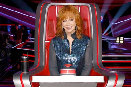 Reba McEntire sits in her coaches chair during The Voice Episode 2502