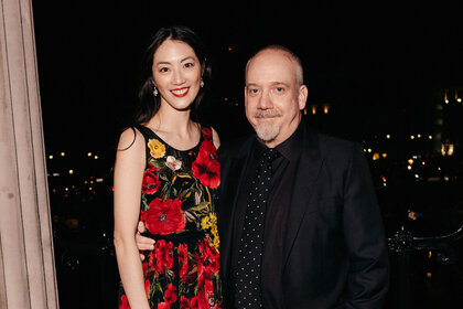Clara Wong and Paul Giamatti pose for a photo at the Nominees' Party for the EE BAFTA Film Awards 2024