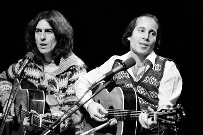 George Harrison and Paul Simon perform on Saturday Night Live on November 20, 1976.