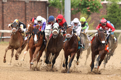 The field rounds the fourth turn in the 148th Kentucky Derby