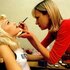 Gwen Stefani getting her makeup retouched by Nancy Von Der Launitz.