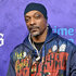 Snoop Dogg wears a hoodie on the red carpet for the World Premiere The Underdoggs