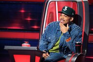 Chance the Rapper smiling in his chair.