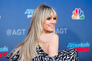 Heidi Klum poses and smiles at an America's Got Talent red carpet event