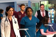 Dr. Natalie Manning, Maggie Lockwood, Dr. Will Halstead, and Dr. Daniel Charles standing next to each other in a scene from Chicago Med.