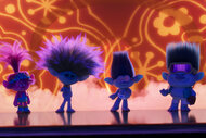 Four Trollz On a dimly lit stage performing