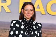 Maya Rudolph wears a black and white polk-a-dotted top while smiling at the camera.
