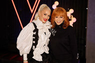 Gwen Stefani and Reba McEntire smile and pose together backstage