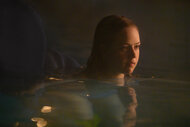 Izzy Waller swims in a pool in Night Swim